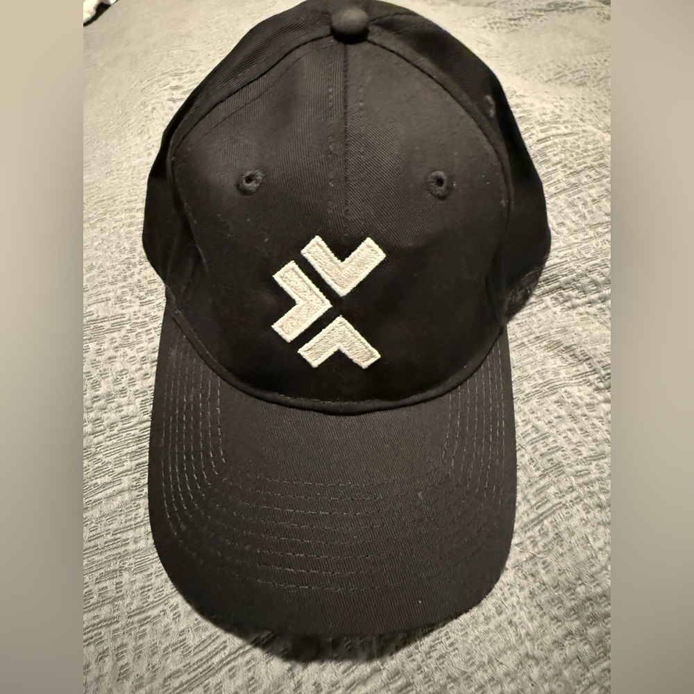 NWOT Black Baseball Cap with White Logo Unleash